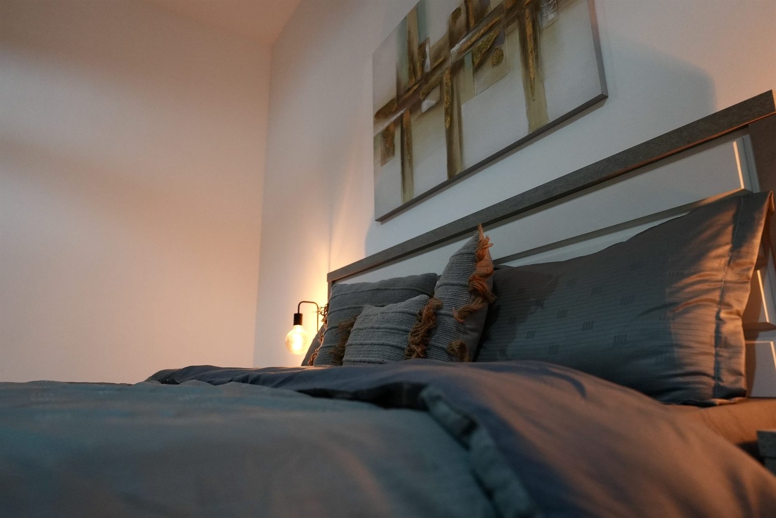 Second master bedroom detail with soft lighting