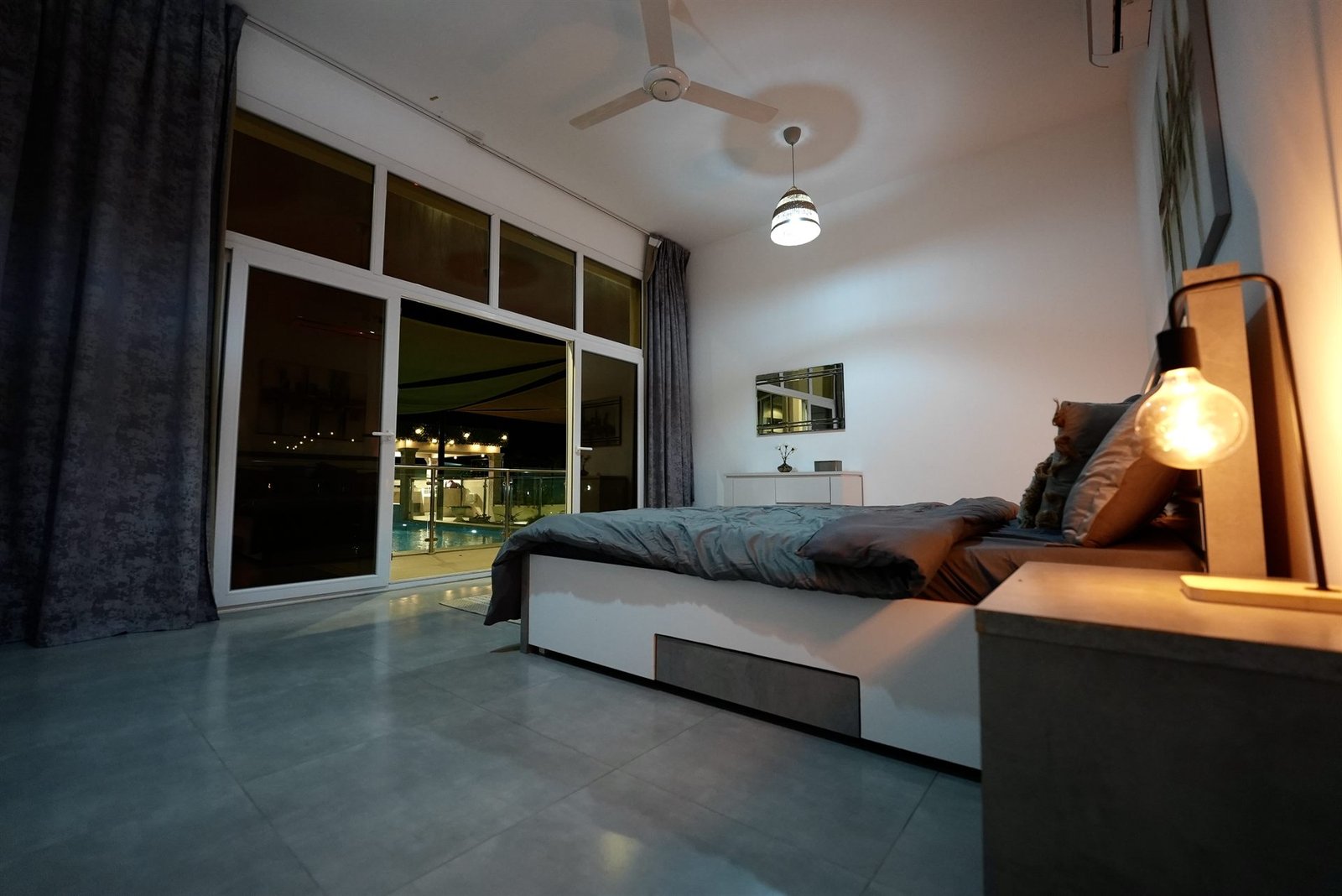 Master bedroom with king bed and pool view
