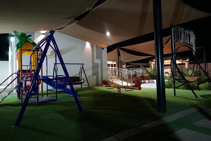 Kids playground with swings and slide