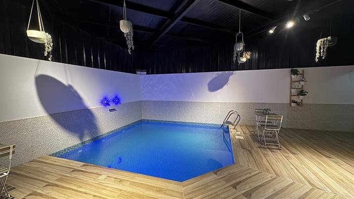 Indoor pool with blue lighting